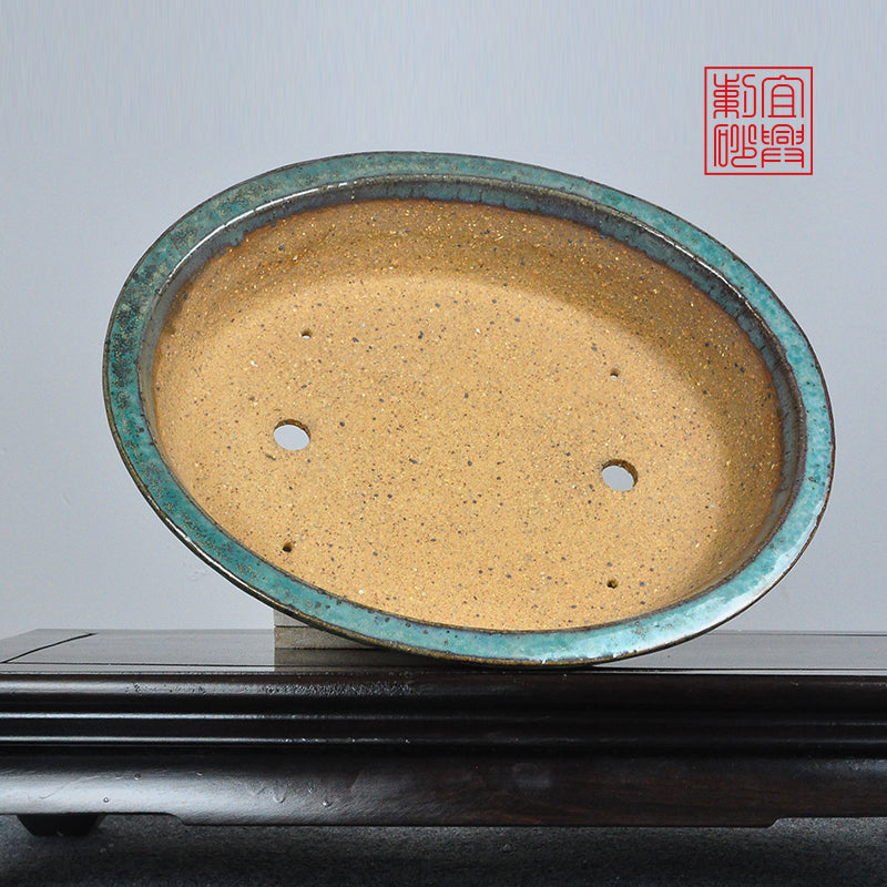 Oval coarse sand glaze basin fired at high temperature