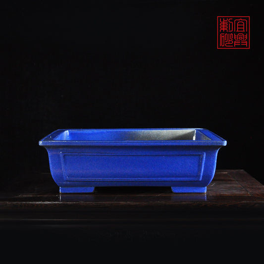 Dark blue rectangular glazed pot with open windows