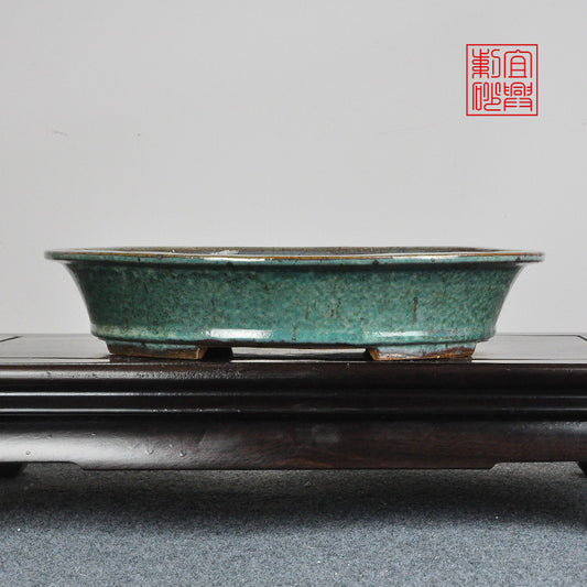 Oval coarse sand glaze basin fired at high temperature